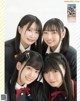 A group of young women in school uniforms posing for a picture.